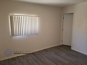 Signal Hill apartment for rent - the interior of a bedroom with a window and a door